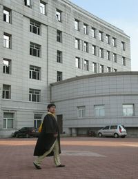 Rear view of woman standing in city