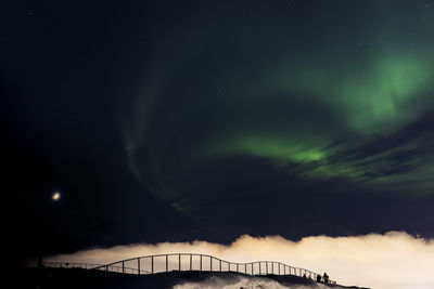 Low angle view of dramatic sky at night