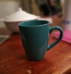 Close-up of coffee cup on table