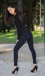 Full length portrait of young woman