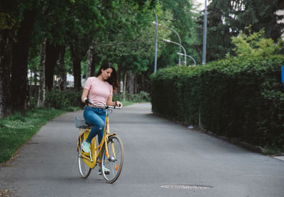 Man riding bicycle on road