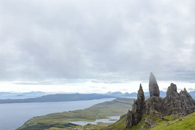 Panoramic view of mountain range against cloudy sky