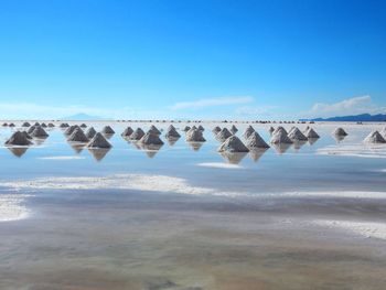 Scenic view of sea against blue sky