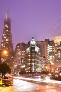 Illuminated buildings in city at night