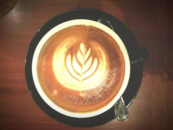 Directly above shot of coffee cup on table