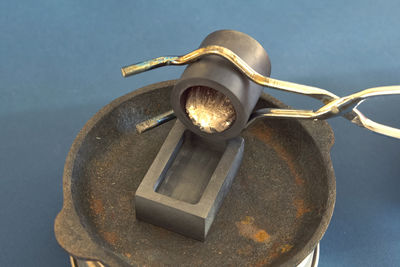 High angle view of rusty metal on table