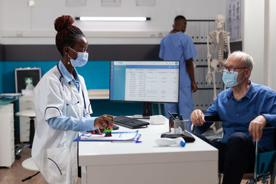 Female doctor working in office