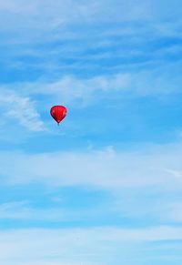 Low angle view of balloons against sky