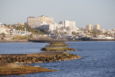 View of river with buildings in background