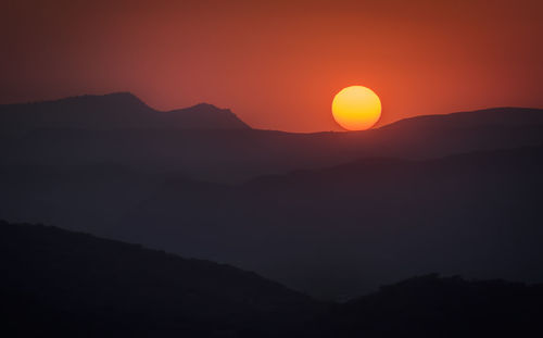 Scenic view of mountains at sunset