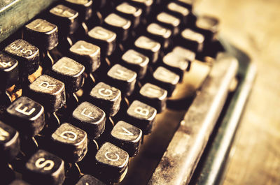 Close-up of abandoned typewriter on table