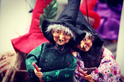 Close-up of witch puppets