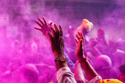 People playing with powder paint in city