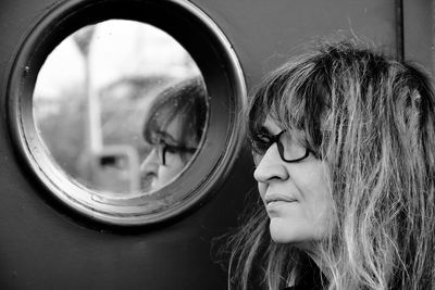 Close-up portrait of woman with reflection