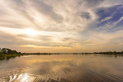 Scenic view of lake against sky during sunset