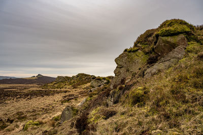 Rock formation on land against sky