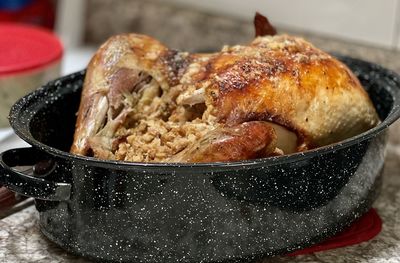 Close-up of meat in cooking pan on table