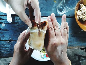 Midsection of woman holding ice cream