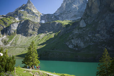 Scenic view of lake and mountains against sky