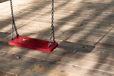 High angle view of empty deck chairs on floor