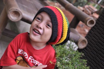 Close-up of cheerful boy wearing knit hat