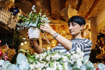 Young man holding flower bouquet