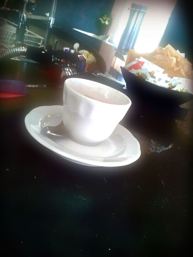 indoors, table, food and drink, still life, drink, refreshment, high angle view, illuminated, close-up, reflection, freshness, saucer, coffee cup, no people, cup, spoon, candle, glass - material, coffee - drink, drinking glass