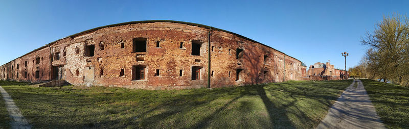 Old building against clear blue sky