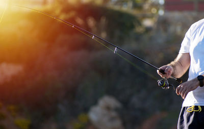 Midsection of man playing outdoors