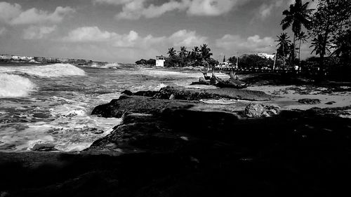 Scenic view of sea against cloudy sky