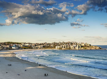 Scenic view of sea and buildings against sky