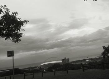 View of beach against cloudy sky