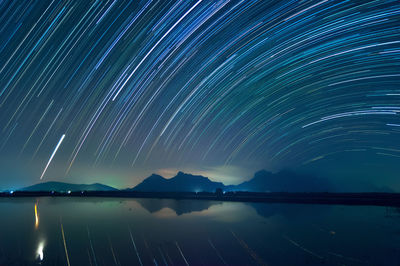 Scenic view of star field against sky at night 
spinning star trail