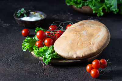 Traditional middle eastern lebanese cream cheese dip with olive oil, spices and herbs with pita.