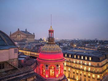 Illuminated dome against clear sky at night