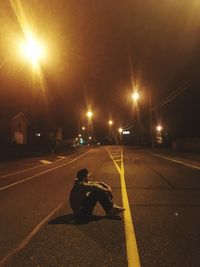 Man on road at night