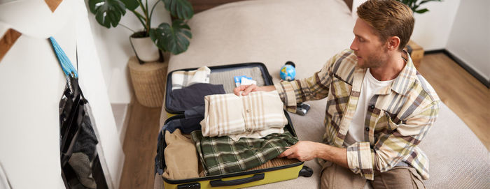 High angle view of young woman using digital tablet