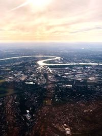 Aerial view of city against sky during sunset