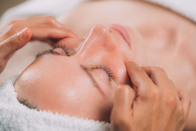 Close-up of woman getting massage therapy at spa