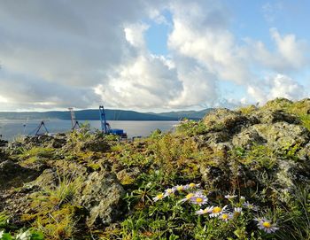 Scenic view of sea against cloudy sky