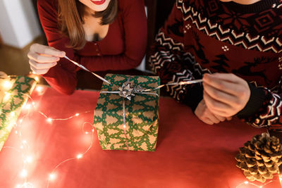 Young couple in love with christmas presents in a festive atmosphere