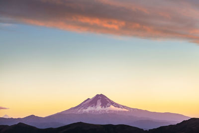 Scenic view of mountains against sky during sunset