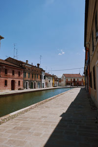 Buildings in city against sky