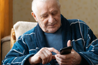 Young man using mobile phone