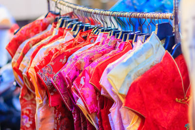 Close-up of clothes hanging in store for sale