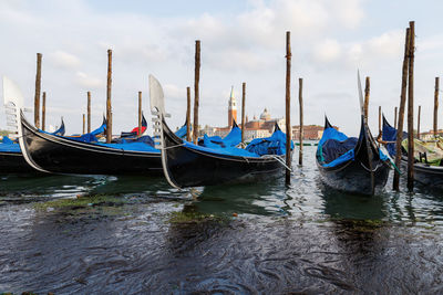 Boats moored in canal