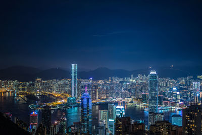 High angle view of illuminated city buildings against sky