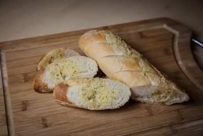 High angle view of bread on cutting board