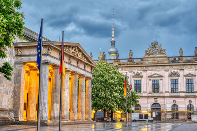 The neue wache memorial at unter den linden in berlin at dawn with the german history museum 