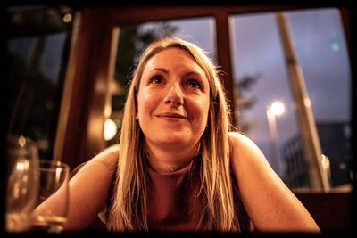 Portrait of smiling woman sitting at restaurant